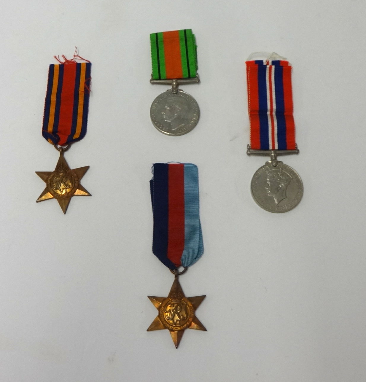 A set of 4 World War II Medals, Burma Star, 1939-1945 Star, The Defence Medal and the 1939-1945