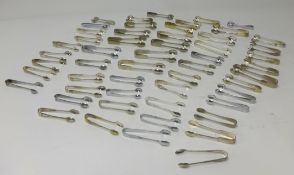 A collection of silver plated sugar tongs (approx. 53).