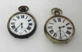 Two 'goliath' keyless pocket watches, each with roman numerals and sub second dials.