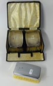 A pair silver back clothes brushes, cased and another silver plated back brush.