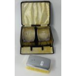 A pair silver back clothes brushes, cased and another silver plated back brush.