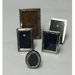 Three silver photo frames 1933, 1910 and 2 other silver photo frames (5).