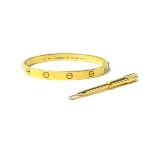 CARTIER a 18ct yellow gold love bangle with associated screwdriver, engraved to the inside 19,750,