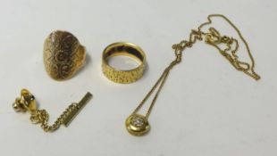 A gents 9ct gold signet ring, a gold band ring, indistinctly stamped, a gold pendant necklace and