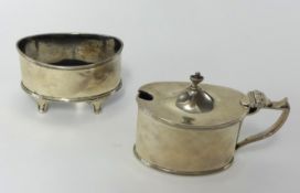 A pair of Adam style silver condiments comprising a mustard pot and table salt on shaped feet (