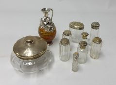 A collection of silver top and glass dressing table bottles (7) also a silver and glass powder