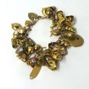 A 9ct gold charm bracelet, weight 125g.