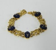 A modern Egyptian gold & lapis lazuli scarab beetle bracelet, length 18cm.