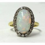 An 18ct opal cluster ring, size T.