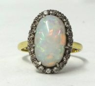 An 18ct opal cluster ring, size T.