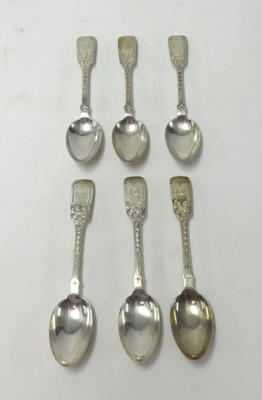 A set of six Geo. V silver bright cut and fiddle patterned teaspoons, London, maker, CTM. Possibly