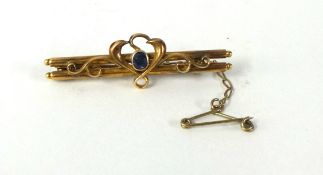 A 15ct gold brooch set with small sapphire, weight 3.70g.