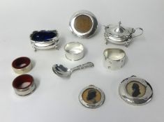 Various silver wares including table salt, napkin rings, mustard pot, miniature circular photo