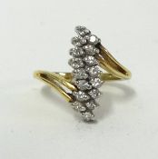 A two row diamond set ring of small size, set in yellow metal, size E.