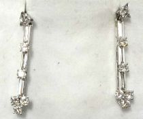 A god pair of platinum and diamond drop earrings