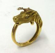 An 18ct Unicorn ring set with diamond eyes. Size L.