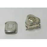 A small silver ring box on 3 feet with mother pearl flower inset together with a silver vesta (2).