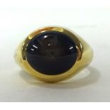 A gents 18ct gold signet ring set with a good star sapphire of  form, ring size P.