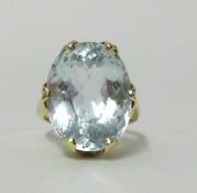 A large pale aqua marine single stone ring, set in a yellow metal shank, indistinctly hallmarked,