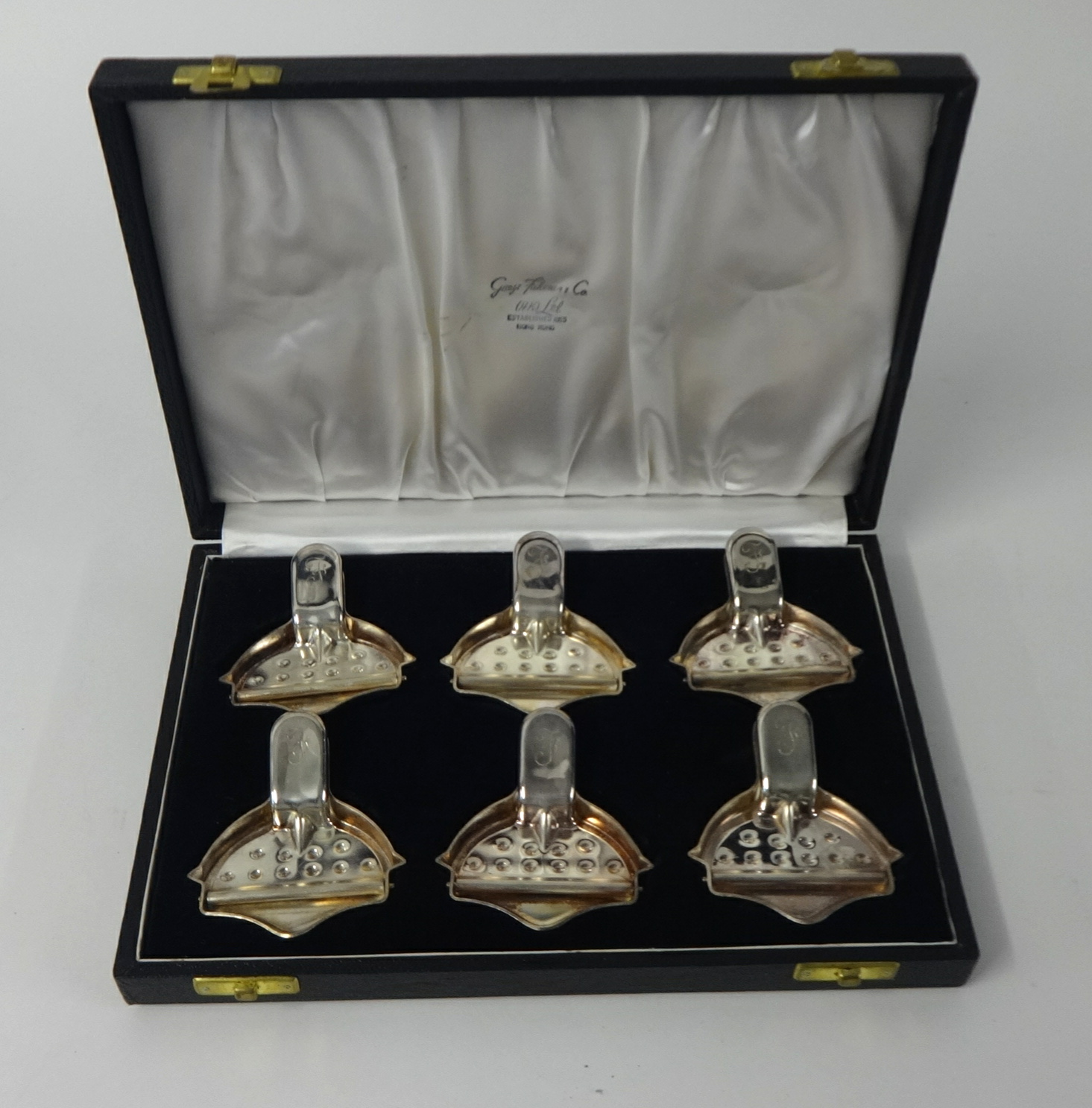 A cased set of six lemon squeezers, the cased with Hong Kong maker.