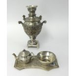 A small middle eastern white metal samovar set including tray, teapot and bowl, height 27cm.