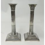 A pair of Victorian silver candle sticks of Corinthian Column design.