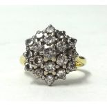 An 18ct gold diamond cluster ring, size M.