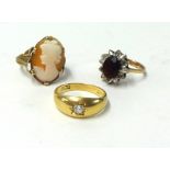 An 18ct diamond set ring, a 9ct garnet ring and a cameo dress ring (3).