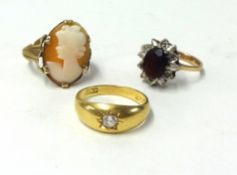 An 18ct diamond set ring, a 9ct garnet ring and a cameo dress ring (3).