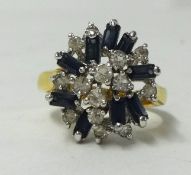 A sapphire and diamond cluster ring in unmarked gold shank, size S.