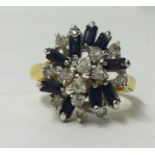 A sapphire and diamond cluster ring in unmarked gold shank, size S.