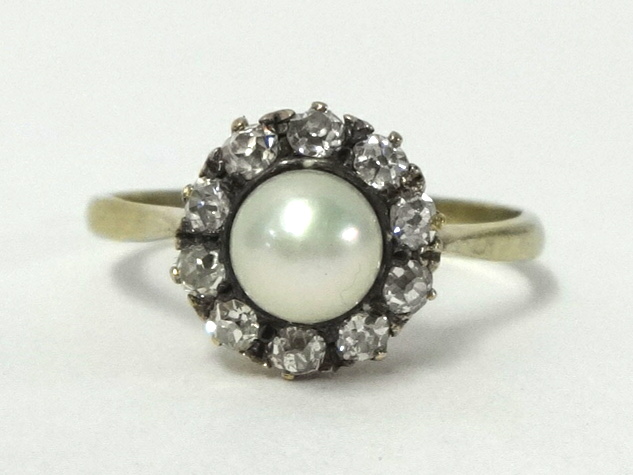 An 18ct gold diamond and pearl set ring, size M 1/2.