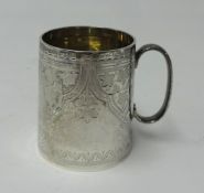 A silver christening mug with engraved leaf decoration and monogram, height 7cm, marked JTH & JHM