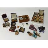 A large collection of various costume jewellery in four assorted boxes.