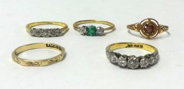 An antique emerald and diamond ring and four other rings (5)..