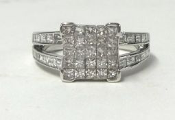 An 18ct diamond square set ring, size N.