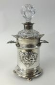 A silver decanter stand, weight 14.65oz,  and a glass decanter with silver neck (2).