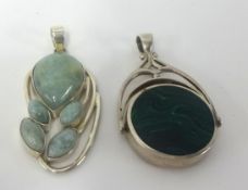 A large silver and hardstone swivel fob and a silver and hardstone pendant (2)