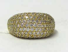 An 18ct ring with pave set diamonds, size S.