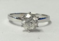 A diamond solitaire ring, approx. 1.00 carat set in a wide band, size N.