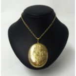 A 9ct gold locket on fine 9ct gold chain, weight 38.60g.