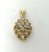 A modern diamond set gold pendant, stamped 14k.