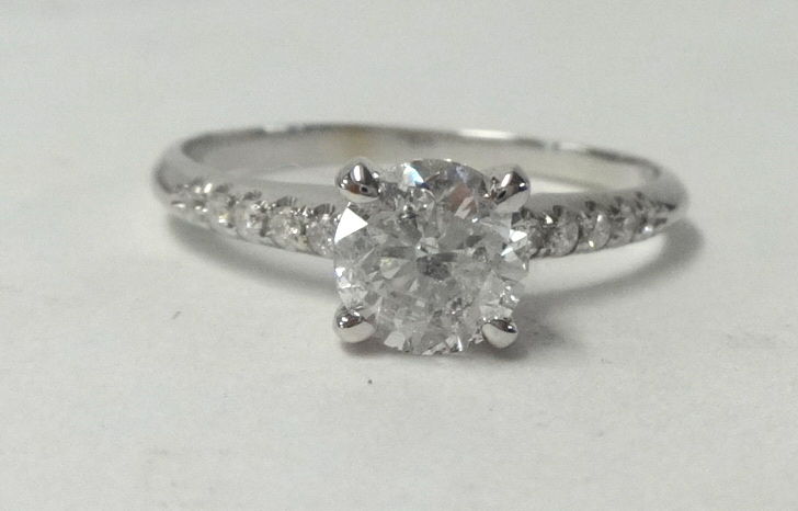 A diamond solitaire 4 prong shank ring, approx. 1.00 carat.