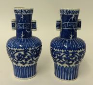 A pair of Chinese blue and white porcelain vases, height 20cm (some damage) with six character