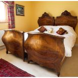 An Antique French King Size double bed with twin walnut bombe style head and foot boards with