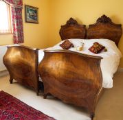 An Antique French King Size double bed with twin walnut bombe style head and foot boards with