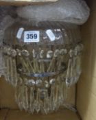 An old glass chandelier light fitting