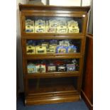 An oak four section bookcase, of Globe Wernicke style, height 140cm.