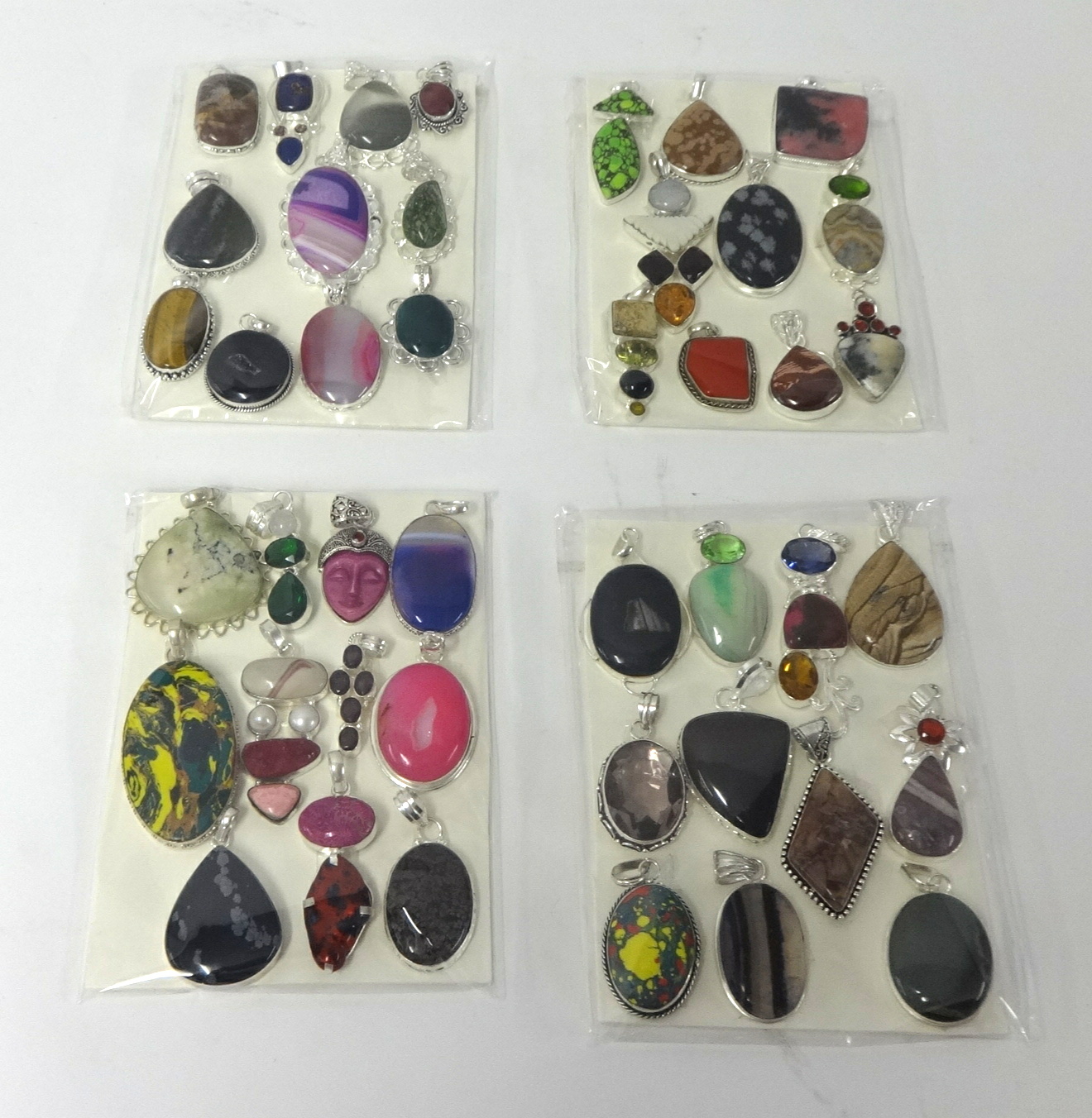 Collection of various decorative costume jewellery pendants (displayed in four packages) - Image 2 of 2