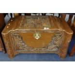 A carved Chinese blanket chest.